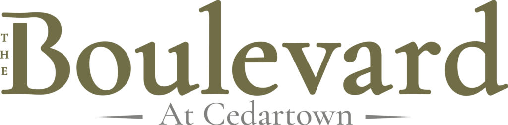 Logo for “The Boulevard at Cedartown” in olive green and gray text, with “Boulevard” prominently displayed and “The” and “At Cedartown” in smaller letters.